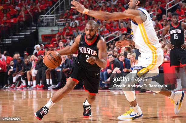 Chris Paul of the Houston Rockets handles the ball against the Golden State Warriors during Game Two of the Western Conference Finals of the 2018 NBA...