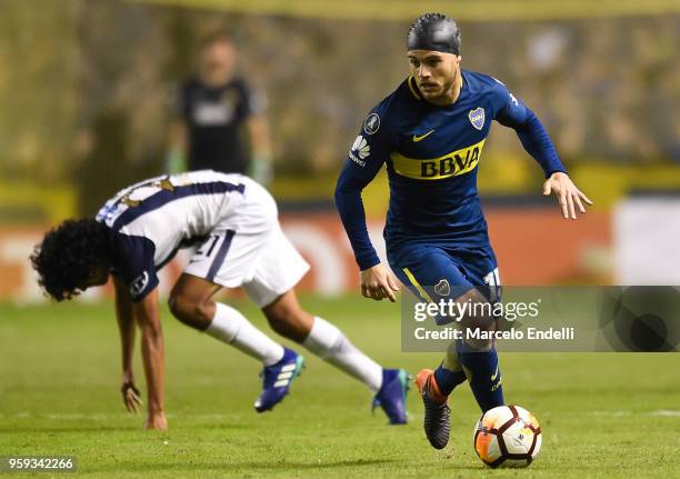 Nahitan Nandez of Boca Juniors fights for the ball with Oscar Vilchez of Alianza Lima during a match between Boca Juniors and Alianza Lima at Alberto...