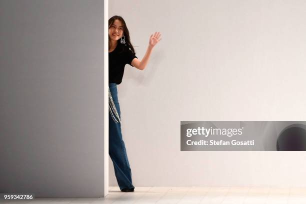 Designer Mengying Wang thanks the audience following the Still Still Studio show at Mercedes-Benz Fashion Week Resort 19 Collections at Carriageworks...