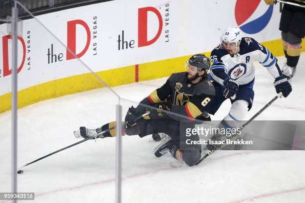 Colin Miller of the Vegas Golden Knights is defended by Mark Scheifele of the Winnipeg Jets during the second period in Game Three of the Western...