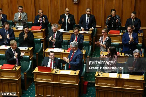 Finance Minister Grant Robertson is applauded by colleagues after his 2018 budget presentation at Parliament on May 17, 2018 in Wellington, New...