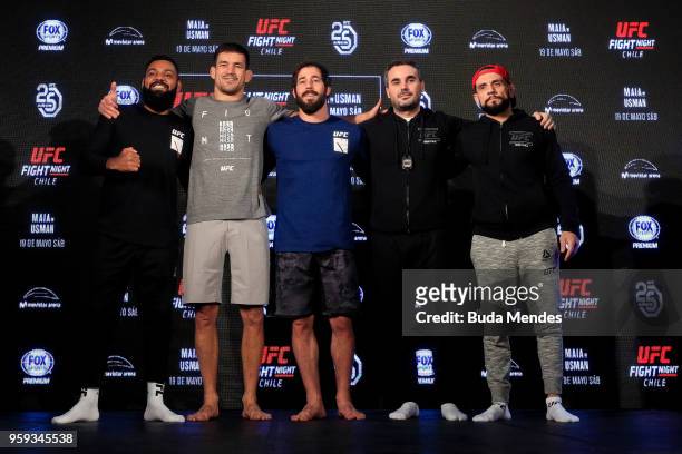 Welterweight contender Demian Maia of Brazil poses with his teammates during an open training session at Mall Sport on May 16, 2018 in Santiago,...