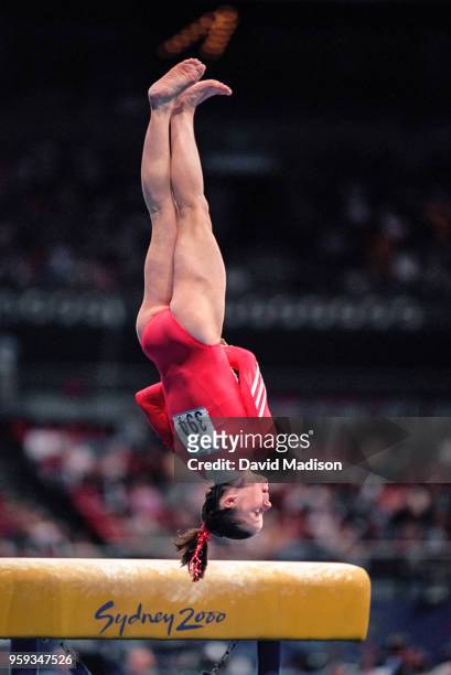 Elise Ray of the United States competes on the vault during the Women's Gymnastics event of the Olympic Games on September 15, 2000 in Sydney,...