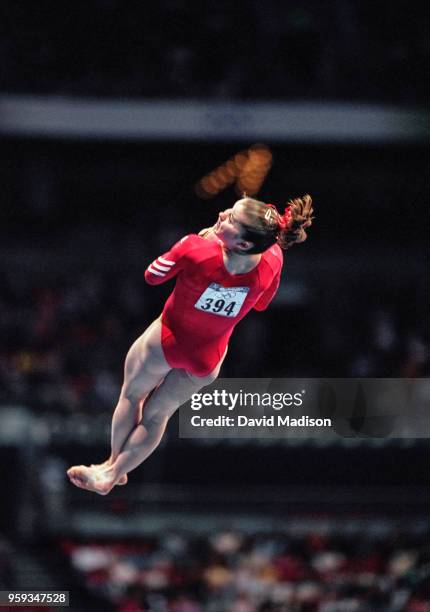 Elise Ray of the United States competes on the vault during the Women's Gymnastics event of the Olympic Games on September 15, 2000 in Sydney,...