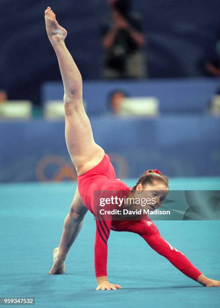 Elise Ray of the United States competes in floor exercise during the Women's Gymnastics event of the Olympic Games on September 15, 2000 in Sydney,...