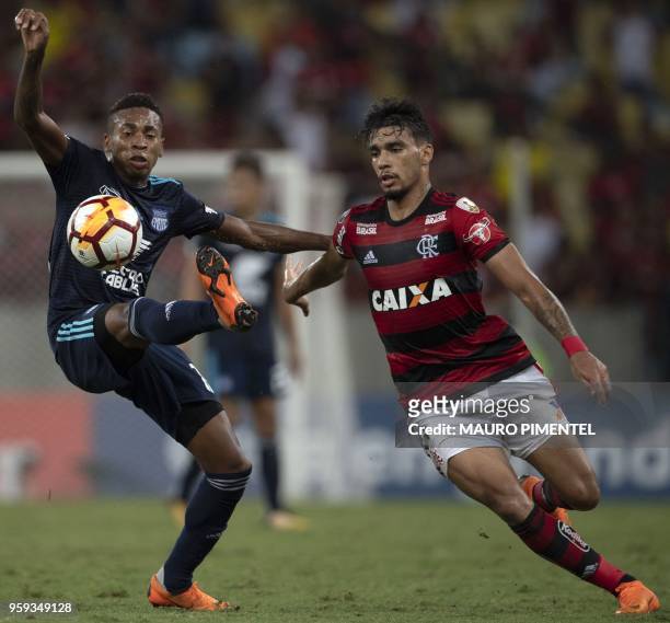 Ecuador's Emelec player Eduar Preciado vies for the ball with Brazil's Flamengo team player Lucas Paqueta during their Copa Libertadores 2018...
