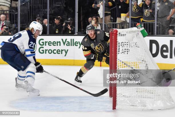 Jonathan Marchessault of the Vegas Golden Knights scores an empty-net goal against Patrik Laine of the Winnipeg Jets in Game Three of the Western...