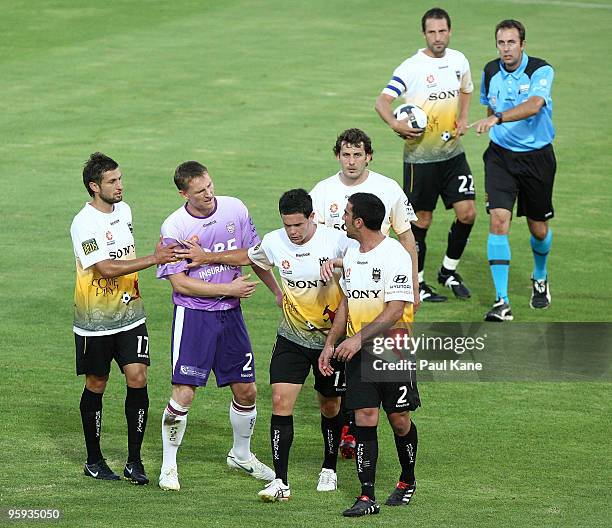 Troy Hearfield of the Phoenix separates Daniel McBreen of the Glory and Emmanuel Muscat of the Phoenix during the round 24 A-League match between the...