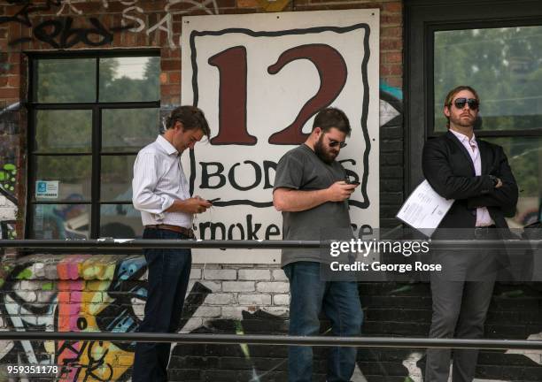 People stand in line at 12 Bones Smokehouse barbecue restaurant in the River Arts District on May 11, 2018 in Asheville, North Carolina. Located in...