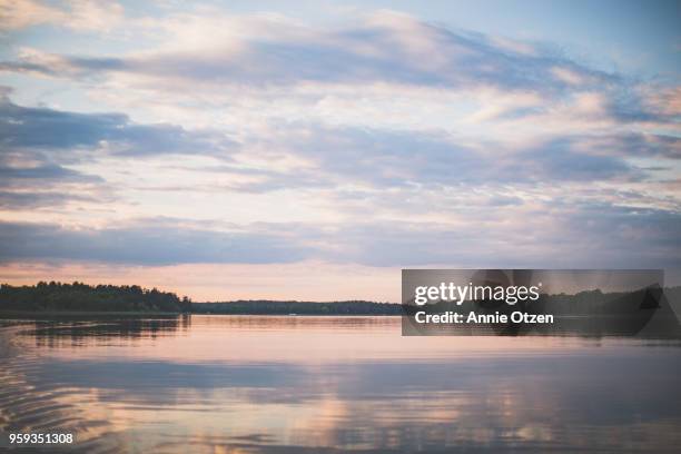 dusk on a minnesota lake - lake horizon stock pictures, royalty-free photos & images