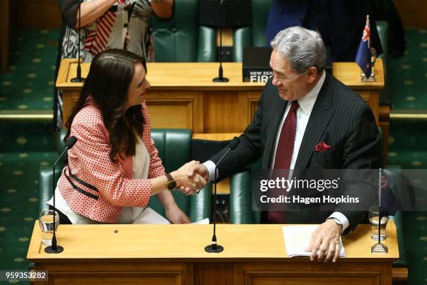 Prime Minister Jacinda Ardern shakes hands with Deputy Prime Minister Winston Peters after her speech during the 2018 budget presentation at...