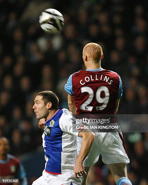 Blackburn Rovers player David Dunn vies with Aston Villa's James Collins during the league cup semi final second leg football match at Villa Park in...