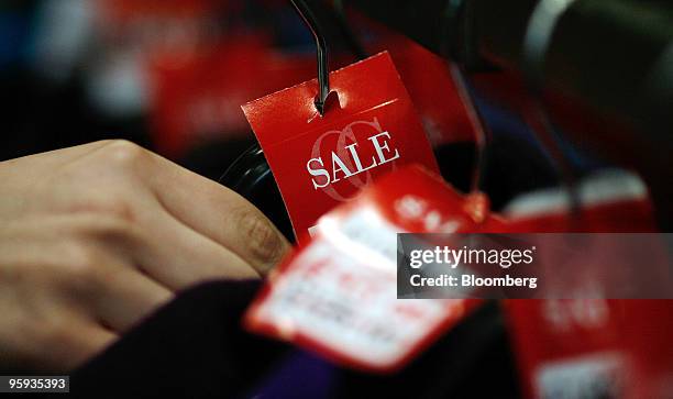 Sale items sit on display at a store in the Bluewater Shopping & Leisure Centre near Greenhithe, U.K., on Thursday, Jan. 21, 2010. U.K. Retail sales...