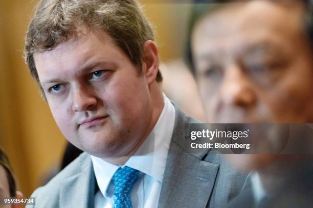 Matthew Chamberlain, chief executive officer of London Metal Exchange Ltd. , left, listens as Charles Li, chief executive officer of Hong Kong...