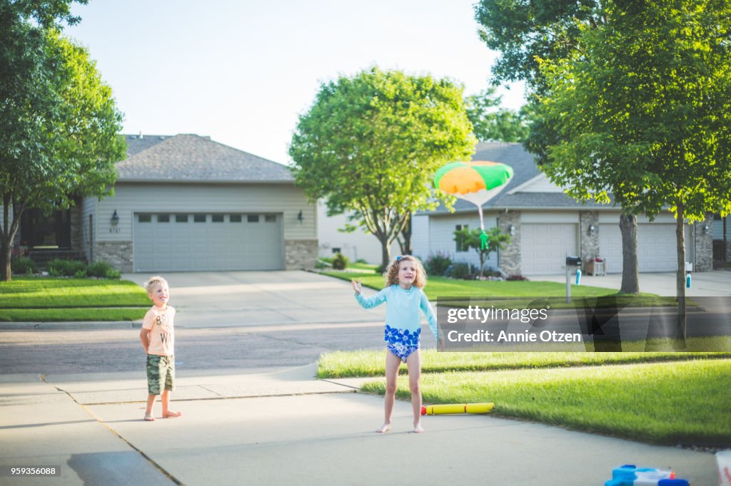 Kids Playing with little parachute man