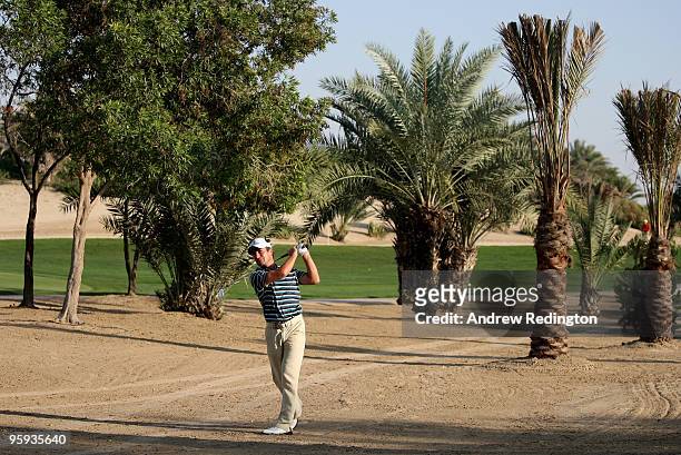 Steve Webster of England plays his second shot on the eighth hole during the second round of The Abu Dhabi Golf Championship at Abu Dhabi Golf Club...