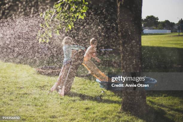 summer kids playing in backyard - annie sprinkle stock pictures, royalty-free photos & images