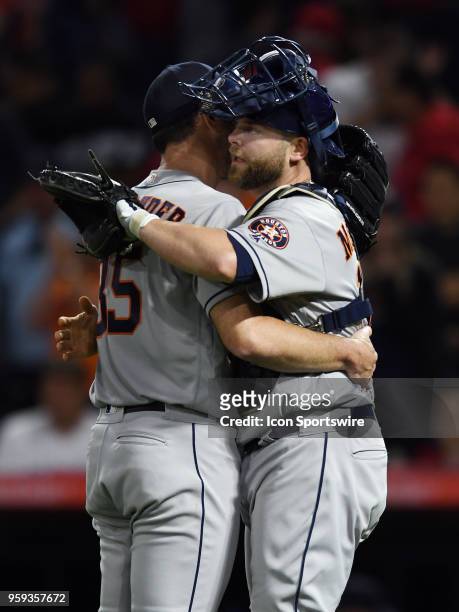 Houston Astros pitcher Justin Verlander hugs catcher Brian McCann after Verlander pitched a complete game to defeat the Los Angeles Angels of Anaheim...