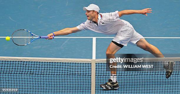 Andy Roddick of the US lunges for a volley while playing Feliciano Lopez of Spain during their men's singles three round match on day five of the...