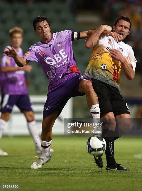 Jacob Burns of the Glory and Tim Brown of the Phoenix contest the ball during the round 24 A-League match between the Perth Glory and the Wellington...