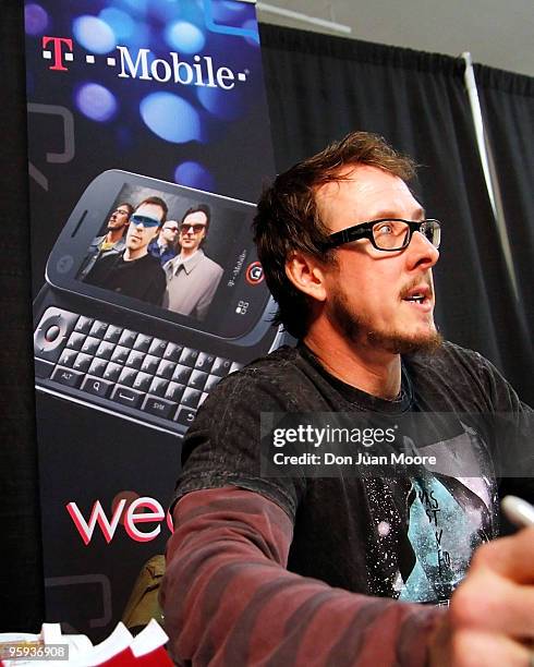 Scott Shriner of Weezer signs autographs before a performing at the T-Mobile Motorola CLIQ Challenge Concert on January 20, 2010 in Tallahassee,...