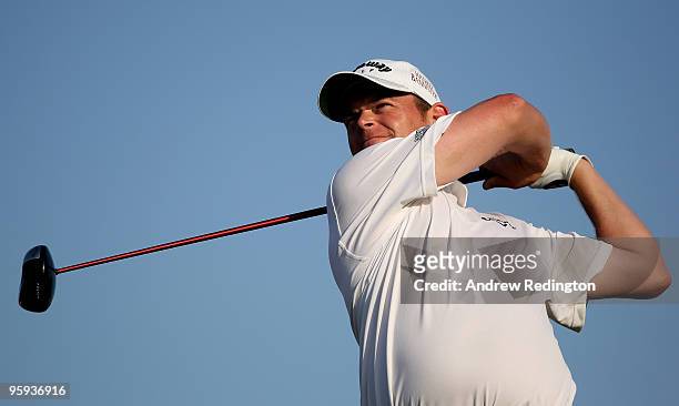 David Drysdale of Scotland hits his tee-shot on the 16th hole during the second round of The Abu Dhabi Golf Championship at Abu Dhabi Golf Club on...