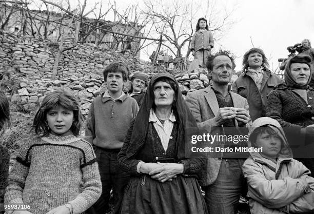 Residents of a small village in north Albania wait for help following the fall of the Communist regime in 1991. The Italian Army, in what was called...