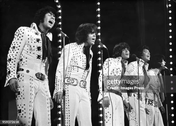 The Osmonds performing on stage at the London Palladium circa 1973 in London, England.