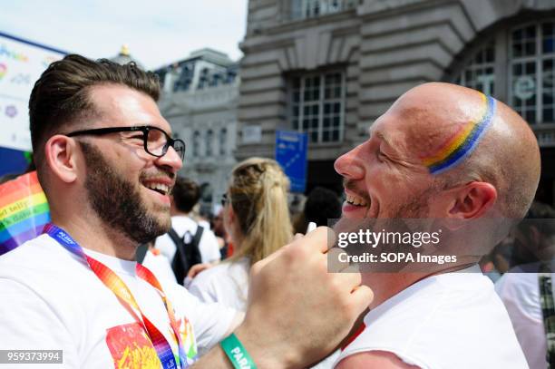 Man on Regent Street has rainbow stripes painted on his head during the 2017 Pride in London Parade through the West End. The event marked 50 years...