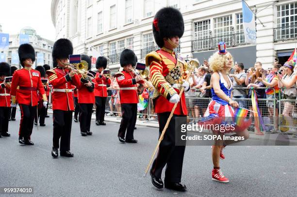 Participant in Stars and Stripes fancy dress marches with the British Army's Band of the Welsh Guards on Regent Street during the 2017 Pride in...