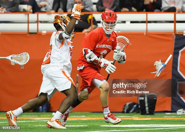 Dami Oladunmoye of the Syracuse Orange breaks his stick while defending Jonathan Donville of the Cornell Big Red during a 2018 NCAA Division I Men's...