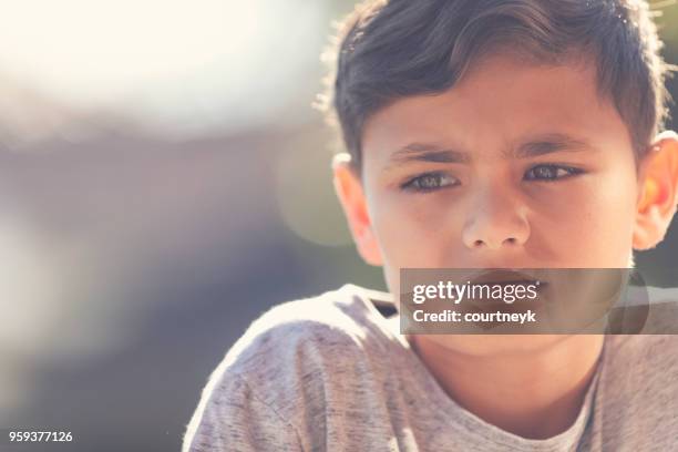 young aboriginal boy portrait. - scared boy imagens e fotografias de stock