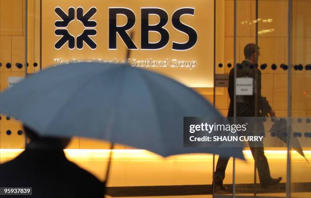 Two men are pictured in a branch of the Royal Bank of Scotland in London on January 22, 2010. Share prices in state-controlled banks Royal Bank of...