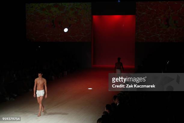 Model walks the runway during the Justin Cassin show at Mercedes-Benz Fashion Week Resort 19 Collections at Carriageworks on May 17, 2018 in Sydney,...