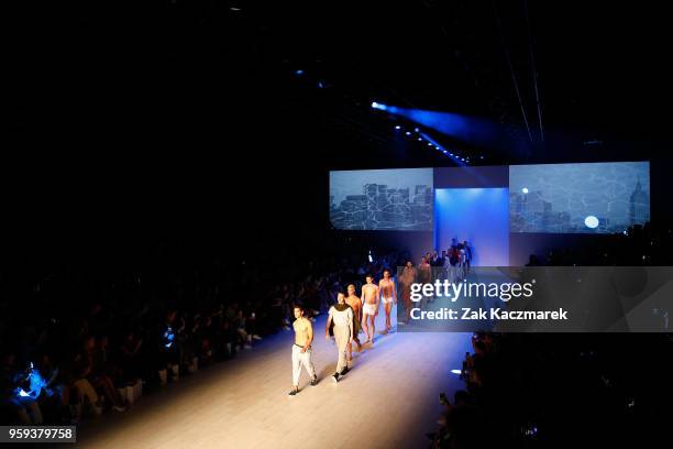 Models walk the runway during the Justin Cassin show at Mercedes-Benz Fashion Week Resort 19 Collections at Carriageworks on May 17, 2018 in Sydney,...