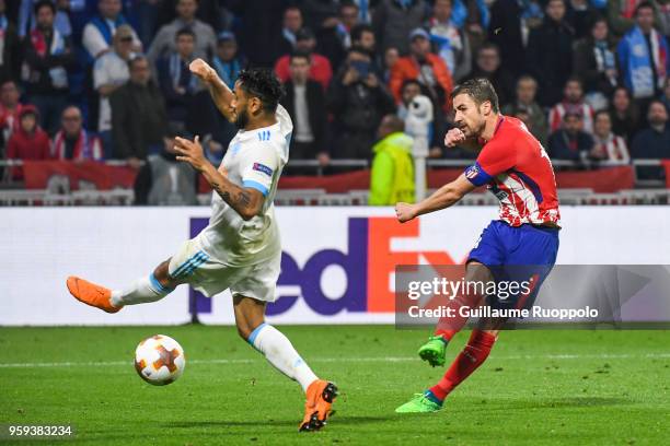Jordan Amavi of Marseille and Gabi of Atletico Madrid scores the third goal during the Europa League Final match between Marseille and Atletico...