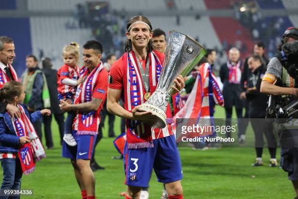 Filipe Luis of Atletico Madrid celebrates with the UEFA Europa League trophy after the final match between Olympique de Marseille and Club Atletico...