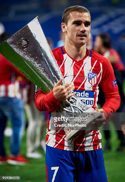 Antoine Griezmann of Atletico de Madrid celebrates with the trophy during the match of the UEFA Europa League final between Atletico de Madrid...