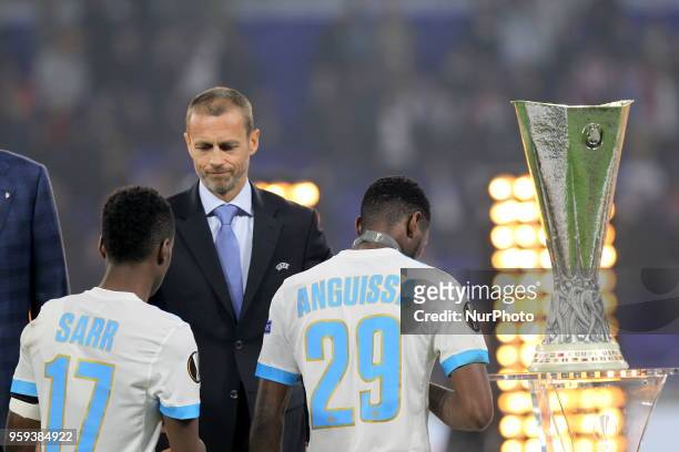 Olympique de Marseille players receive silver medal from UEFA President Aleksander Ceferin after defeat in the final against the Atletico Madrid at...
