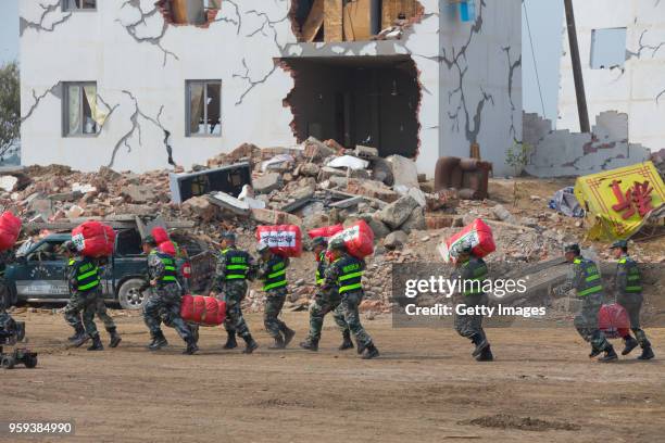 Emergency workers attend the provincial earthquake response drill on May 16, 2018 in Guanghan, Sichuan Province of China. Emergency workers including...