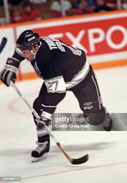John Tonelli of the Los Angeles Kings skates against the Toronto Maple Leafs during NHL game action on November 5, 1988 at Maple Leaf Gardens in...