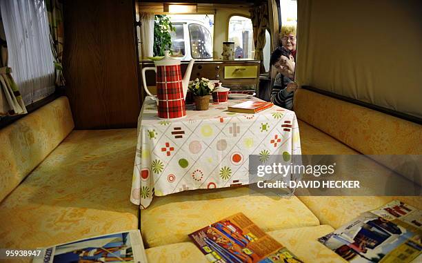 Two women have a look inside one of the caravan old-timers, presented by the "Camping Oldie Club" of Friedeburg, northern Germany during the "Caravan...