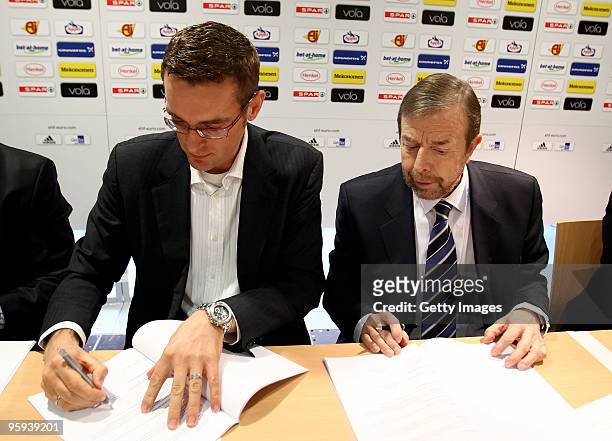Max van den Doel , head of adidas team sport signs the new contract with Tor Lian , president of the EHF during a press conference at the Olympia...