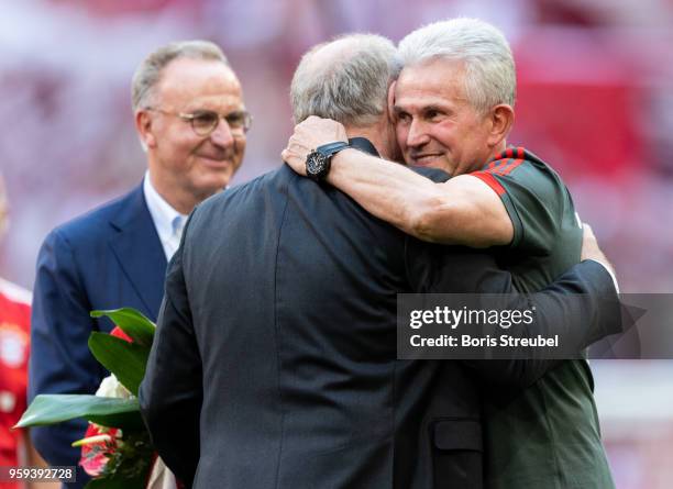 Head coach Jupp Heynckes of FC Bayern Muenchen hugs Bayern president Uli Hoeness during a farewell ceremony prior to the Bundesliga match between FC...