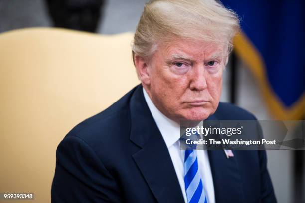 President Donald J. Trump listens to President of the Republic of Uzbekistan Shavkat Mirziyoyev during a meeting in the Oval Office at the White...