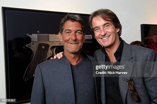 Guido Mocafico and Tim Jeffries attend private view of Guido Mocafico's 'Guns And Roses' on January 21, 2010 in London, England.