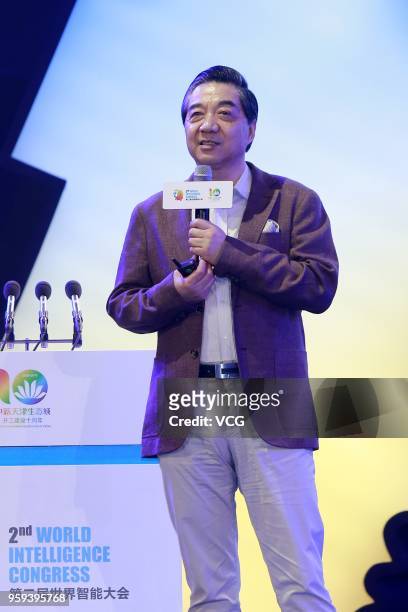 Military theorist of the PLA National Defense University Zhang Zhaozhong delivers a speech during the 2nd World Intelligence Congress at Tianjin...