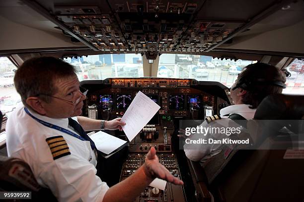 Pilots make final checks before flying a consignment of aid from Oxfam's logistics warehouse in Oxfordshire on a British Airways flight bound for...