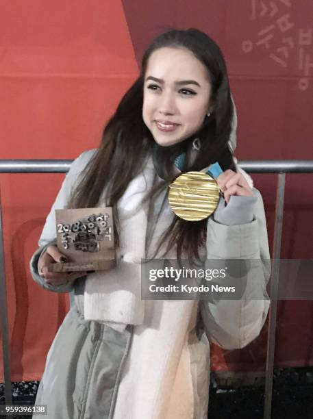 Photo taken on Feb. 23 shows Russian figure skater Alina Zagitova holding her gold medal at the Pyeongchang Winter Olympics in South Korea. Zagitova...