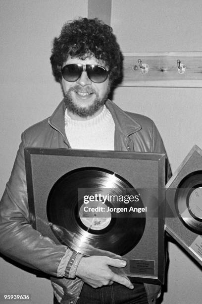 Jeff Lynne of Electric Light Orchestra backstage with gold discs on their 'Time' tour on February 7th 1982 in Copenhagen, Denmark.